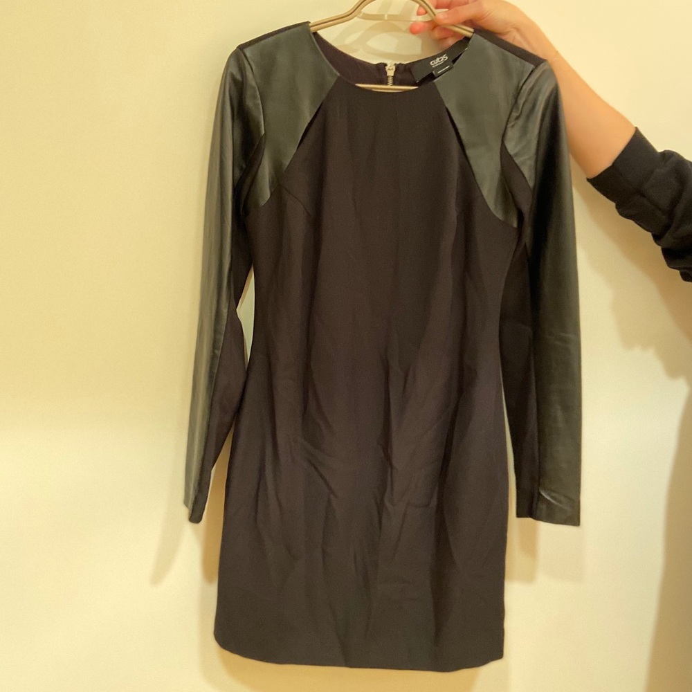 Black dress with cut outs and leather sleeves